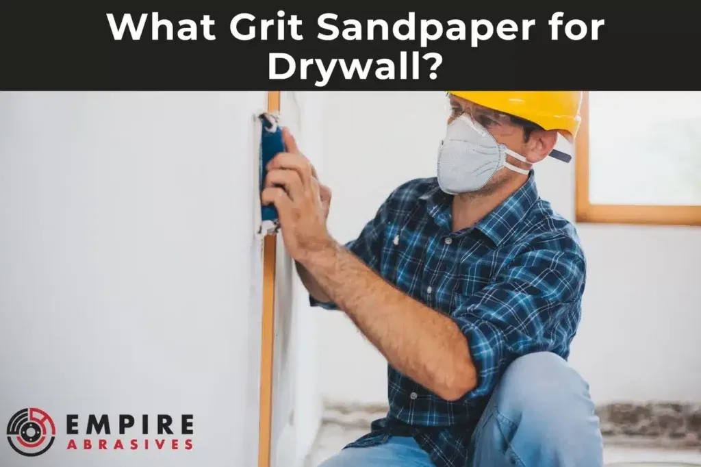 Worker sanding drywall beneath the text “What grit sandpaper for drywall?”